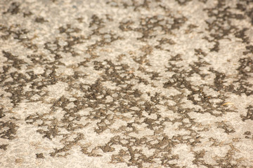 The surface of the old road from broken asphalt, soft focus