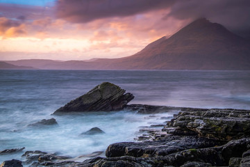 Fototapeta na wymiar Elgol at sunset, on the dramatic Isle Of Skye in scenic Scotland, a fantastic adventure travel destination for a holiday vacation to view awesome picturesque scenery