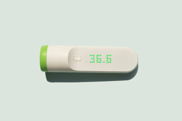 smart infra red thermometer showing optimal body temperature 36,6
