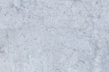 Light white aged concrete polished in cracks.
