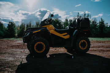 Fototapeta premium Yellow atv, quad in forest