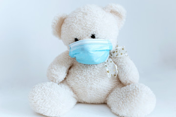 soft toy in a medical mask on a white background