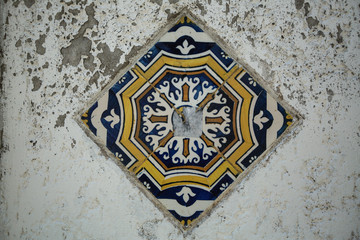 Traditional old tiles wall on the Porto streets, painted tin-glazed, azulejos ceramic tilework.