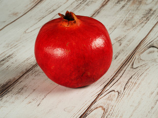 Red ripe pomegranate on a table