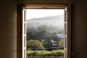 window framed rural landscape view