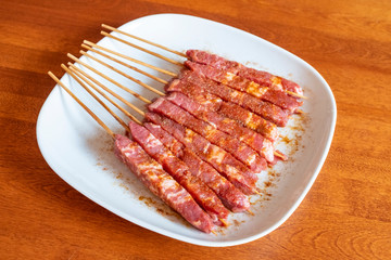 Plateful of Marinated Lamb Skewers or Spiedini Ready for the Grill