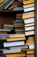 Fototapeta premium A stack of books on the floor in house. Book shelf