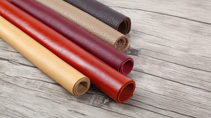 Rolled up multicolored natural leather textures samples