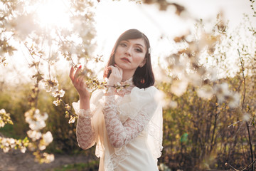 woman in white flowering trees