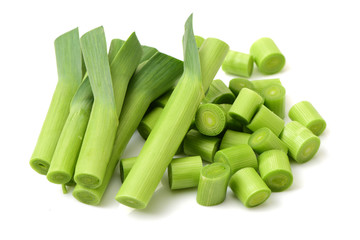 young green garlic leaves isolated on white background