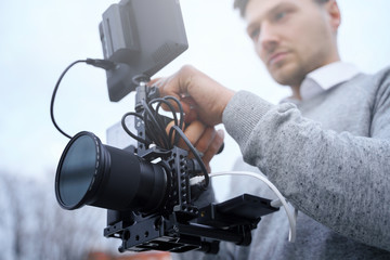 Professional videographer with a modern camera rig