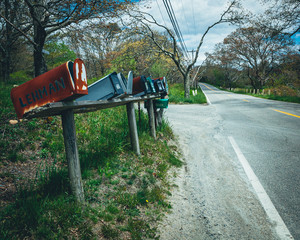 Mailboxes at the side of a rural road in the United States