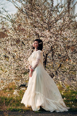 girl near a flowering spring tree