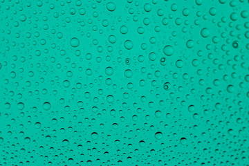 Water drops background. Rain texture on window glass. Wet pattern.