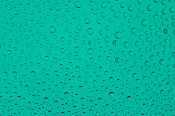 Water drops background. Rain texture on window glass. Wet pattern.