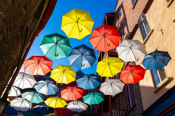 Fototapeta na wymiar Colorful umbrellas in old Quebec