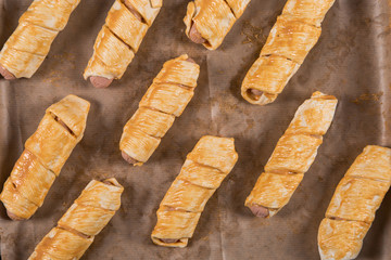 Homemade pastries, sausages in the dough with their own hands, appetizing and simple recipe.