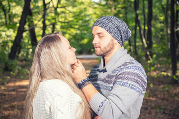 Fototapeta premium Portrait of young couple enjoying a day in the park together