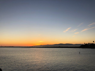 Sun sets over Pacific Ocean in Marina del Rey, CA