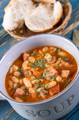 Baked beans in tomato sauce with chopped sausage