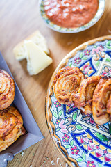 tomato and cheese roll on oriental plate