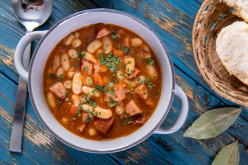 Baked beans in tomato sauce with chopped sausage