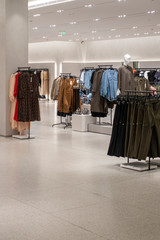 Empty modern fashionable brand interior of clothing store inside shopping center