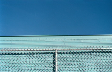 Fototapeta premium chain link fence with blue sky