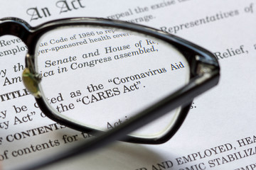 Closeup of the Coronavirus Aid, Relief, and Economic Security Act document. The CARES Act is meant...