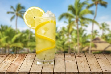 Lemonade with fresh slice lemon on desk