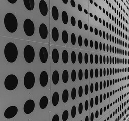 Texture. Metal surface with black round holes.