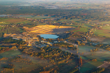 Aerial view background of Poland forests and hills in morning sunrise time. Autumn, Europe.