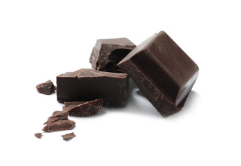 Pieces of delicious dark chocolate isolated on white