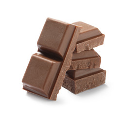 Pieces of delicious milk chocolate isolated on white