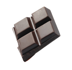 Piece of delicious dark chocolate isolated on white