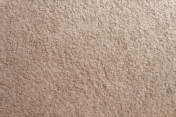 Beige carpet texture. Cozy soft floor at home