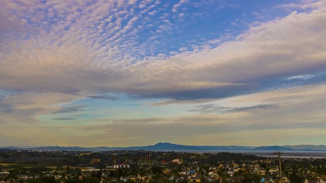 Beautiful skies over Vallejo, Ca. in the early morning at sunrise with clouds moving through the city from above