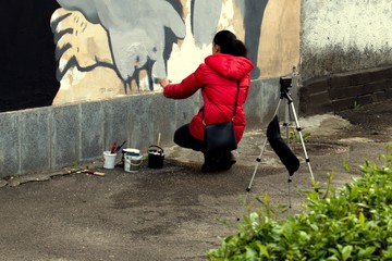 young woman with graffiti