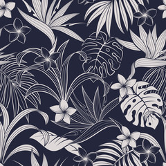 Seamless pattern with tropical leaves and flowers. Elegant dark blue and white exotic background. 