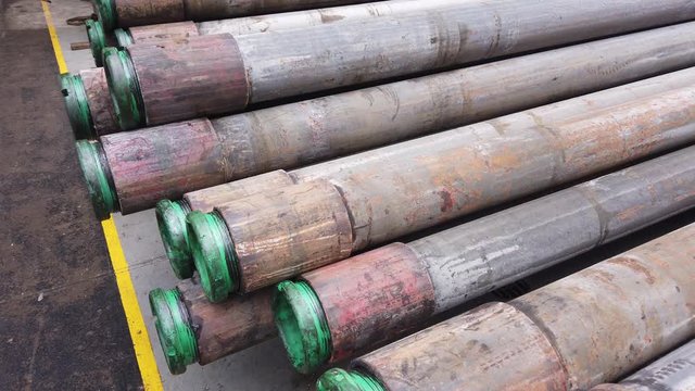 Stack of old casing conductor pulled out of hole after plug and abandonment operation on the drilling rig
