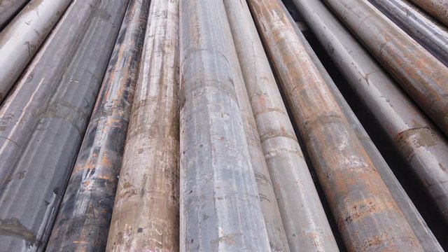 Stack of old casing conductor pulled out of hole after plug and abandonment operation on the drilling rig
