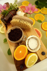 Relaxing bath with fresh fruits and flowers.