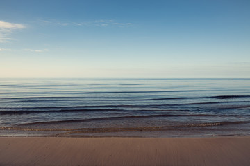 Fototapeta premium Beautiful light sunset over Baltic sea. Natural background. Latvia. Afterglow, evening calm on the Sea