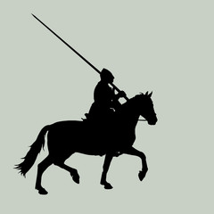 black silhouette of a medieval knight with a spear on a horse in a field, trotting, isolated image on the background of the dawn sky