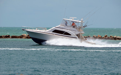 High-end sport fishing boat headed out to sea