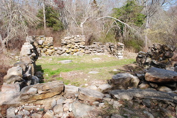 Old farm house/homestead foundation circa early 1800s in the bright light of an early spring day in Massachusetts 