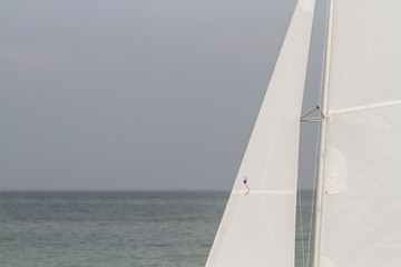 Obraz premium White sail yacht by the seashore, Black Sea, Zatoka, Odesa, Ukraine