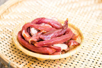 Obraz premium Dried meat in a bamboo dish