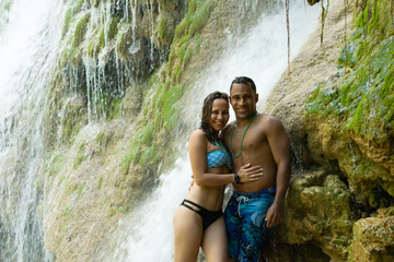 Couple in a hugging waterfall