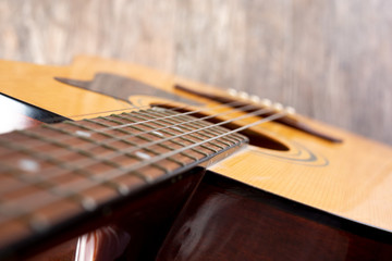 Obraz premium A top down view looking down the neck to the body of an acoustic guitar.